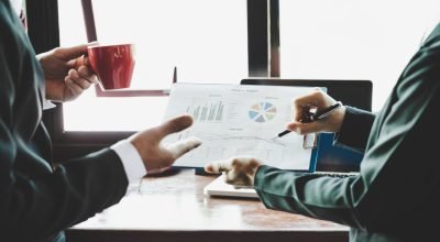 business-team-analyzing-income-charts-graphs (1)