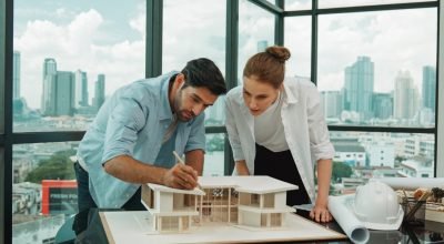 cooperative-engineer-team-working-together-measure-house-model-tracery (1)