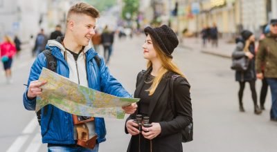 man-woman-smiling-with-map (1)